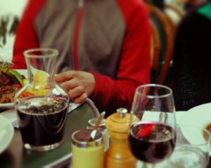 Carefe of wine on a table with a wine glass