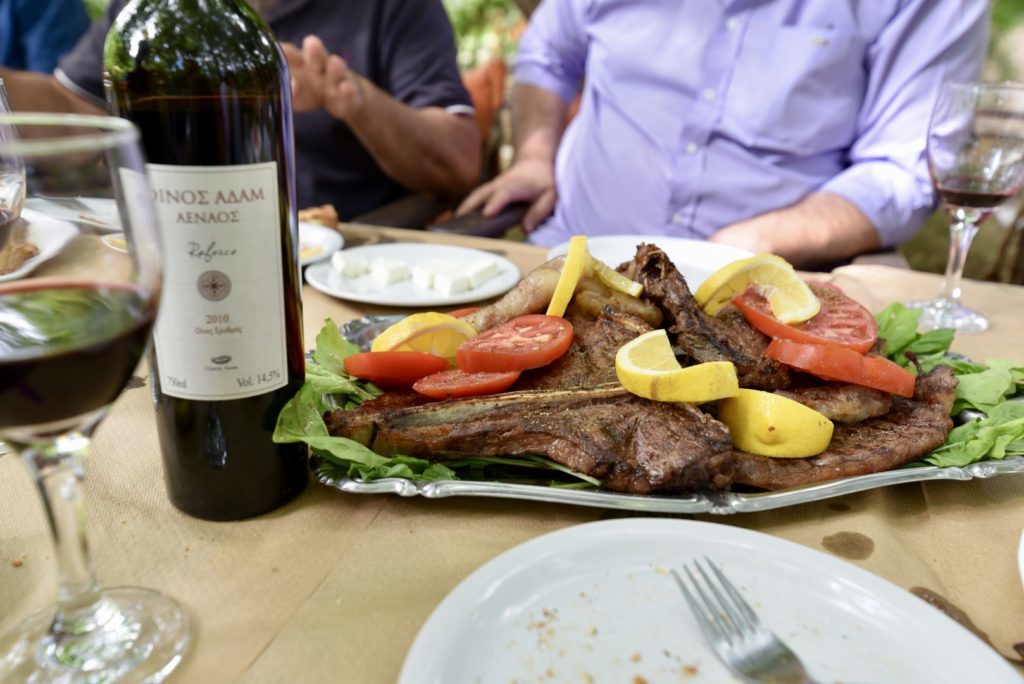 Sharing meal of grilled meat with Refosco from wines of Adam