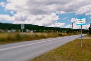 Road sign at the entrance of the village Adam in Thessaloniki