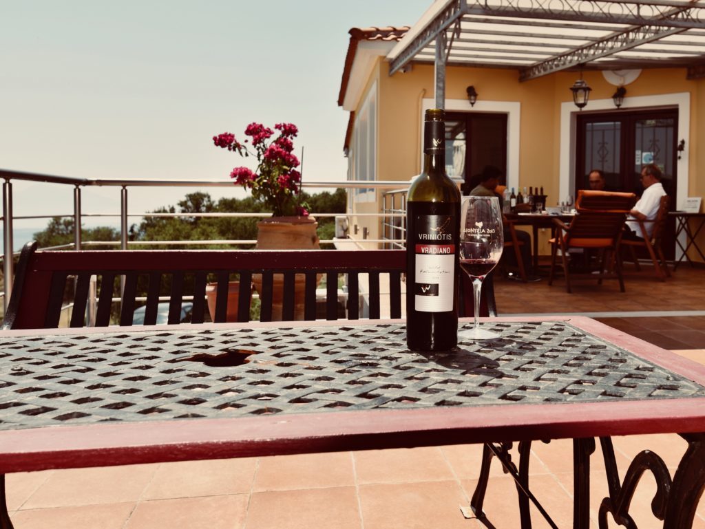 Bottle of Vriniotis winery's Vradiano red wine on a table