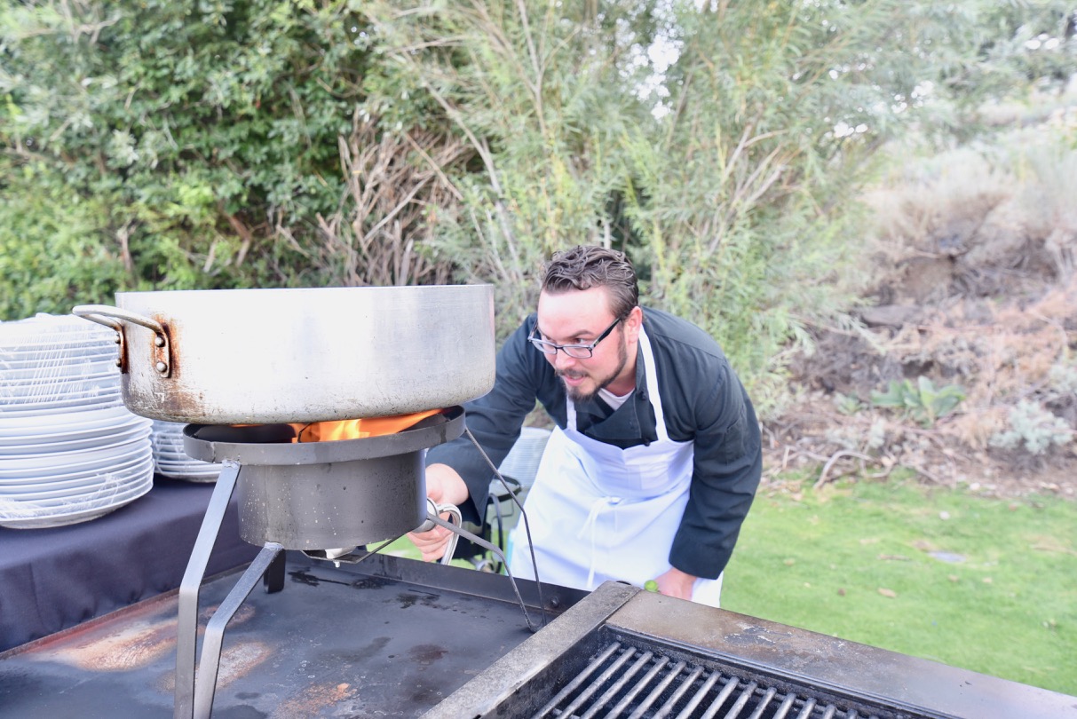 Chef Ericchecking the stove.