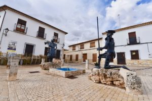 Statue of Don Quixote kneeling to Dulcinea in front of the church in El Toboso