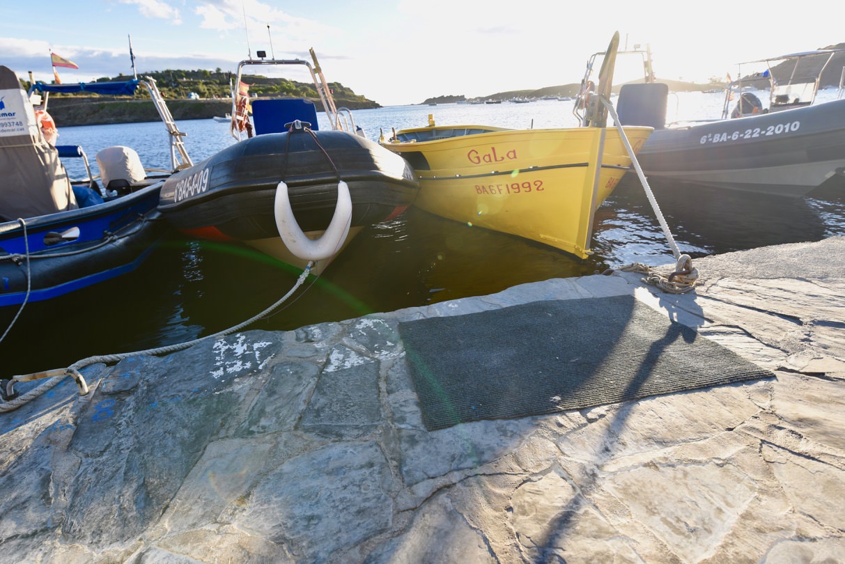 A yellow boat named Gala parked on the quay. This belonged to Salvador Dali and his wife Gala.