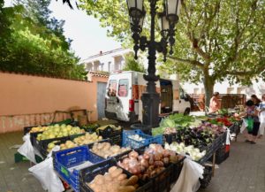 Baskets of vegetables at a farmers market in Spain.