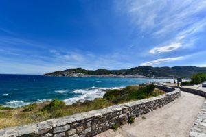 A stone wall along the sea.