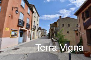 A street in France with buildings on the side.
