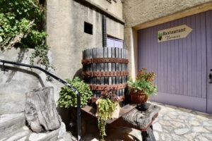 A wooden wine press in the courtyard.