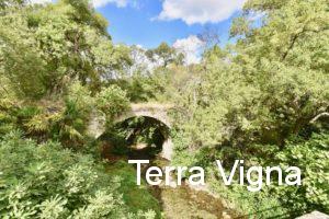 An old bridge over a stream.