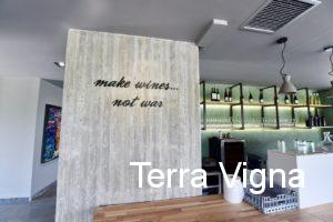 Writing on a wall that says "make wines..not war"