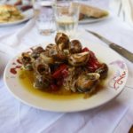 Cooked snails in the Cretan style on a plate.